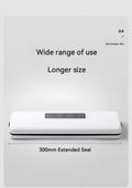 White automatic vacuum sealer machine on a kitchen countertop.