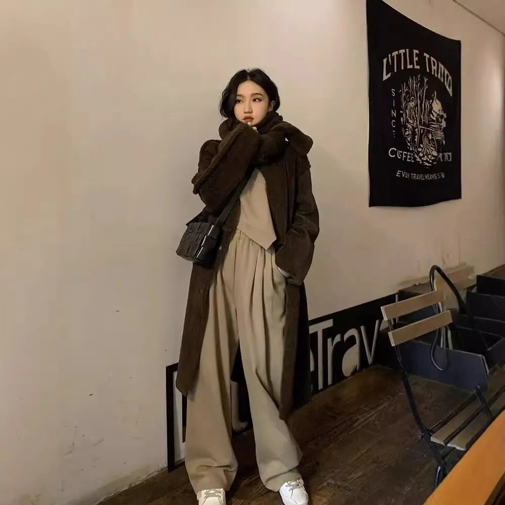 Women's khaki casual sports suit with loose-fit long sleeve top and matching trousers.