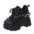 White women's mesh platform sports shoes with cross-strap detail and rubber sole.