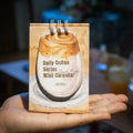 Coffee themed mini desk calendar for 2025 showing four different model designs on a desk.