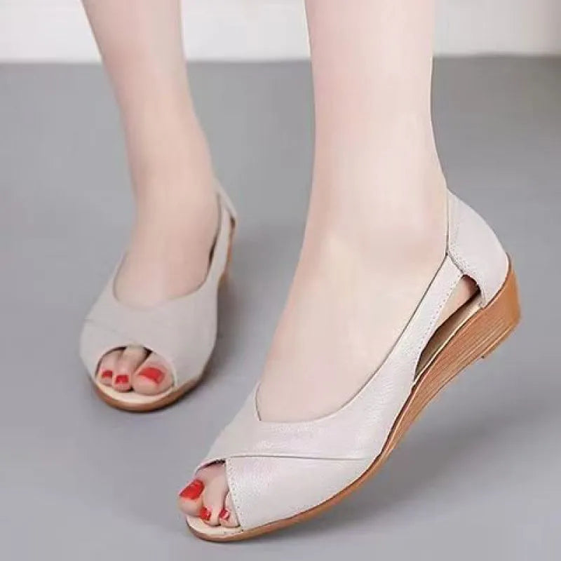 Women's black peep toe sandals with an ankle buckle and a mid rubber heel.