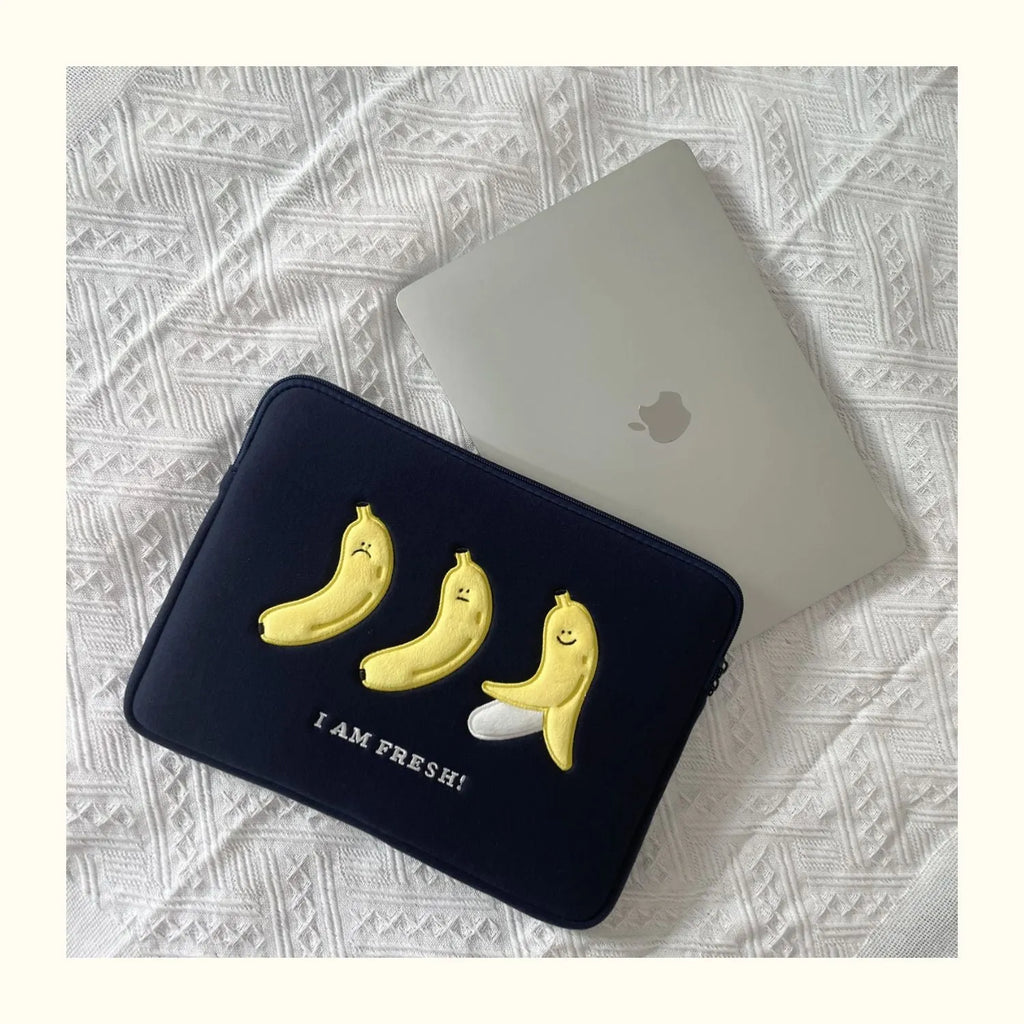 Embroidered laptop sleeve with animal design showing polyester construction and laptop size compatibility
