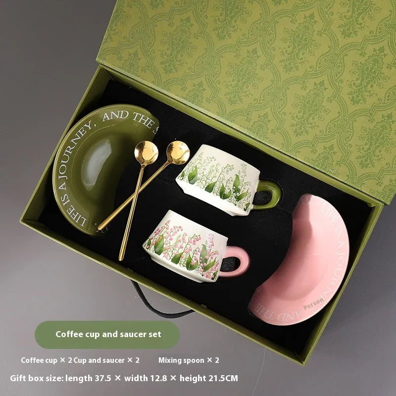 Ceramic coffee cup and saucer set with two cups, two saucers and two stirring spoons