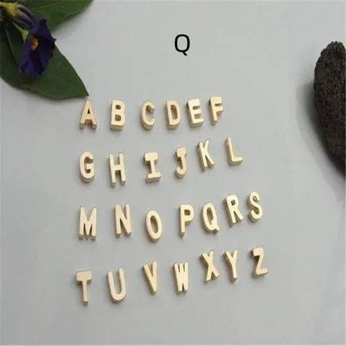 Gold and silver alloy peach heart shaped letter pendant necklace charm on a chain.