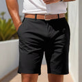 Man wearing light grey straight-leg polyester casual shorts on a summer day.