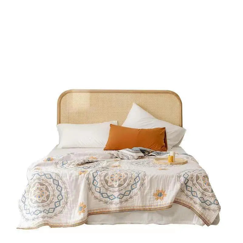 Cotton geometric patterned towel blanket laid flat, showing modern simple design