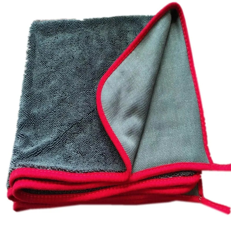Grey car cleaning towel with black trim edge in various sizes from 20x30cm to 60x160cm.