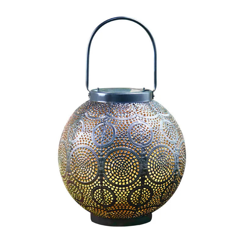 Decorative hollow iron solar courtyard lamp with integrated solar panel and warm white LED illumination
