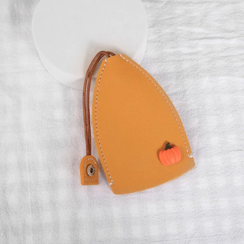 Colourful cartoon pull-out key case made from PU leather, showing the key extended from its protective sleeve.