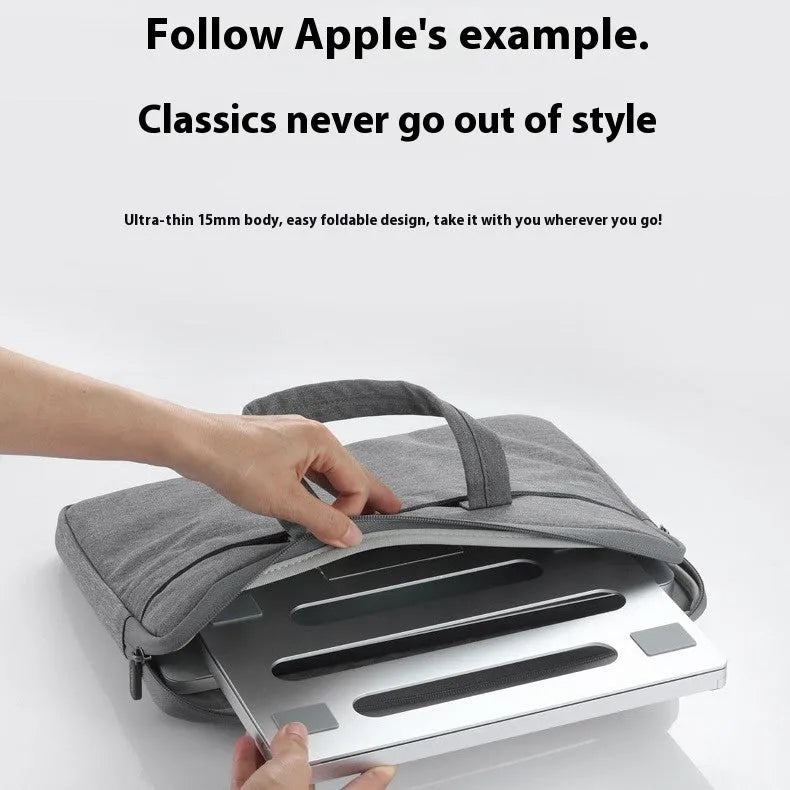 Aluminium alloy folding laptop cooling rack in silver, shown open with a notebook placed on top.