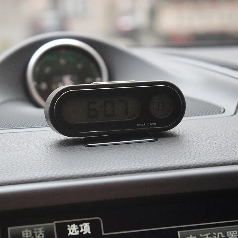 Black digital car clock and thermometer with LED display on adjustable stand