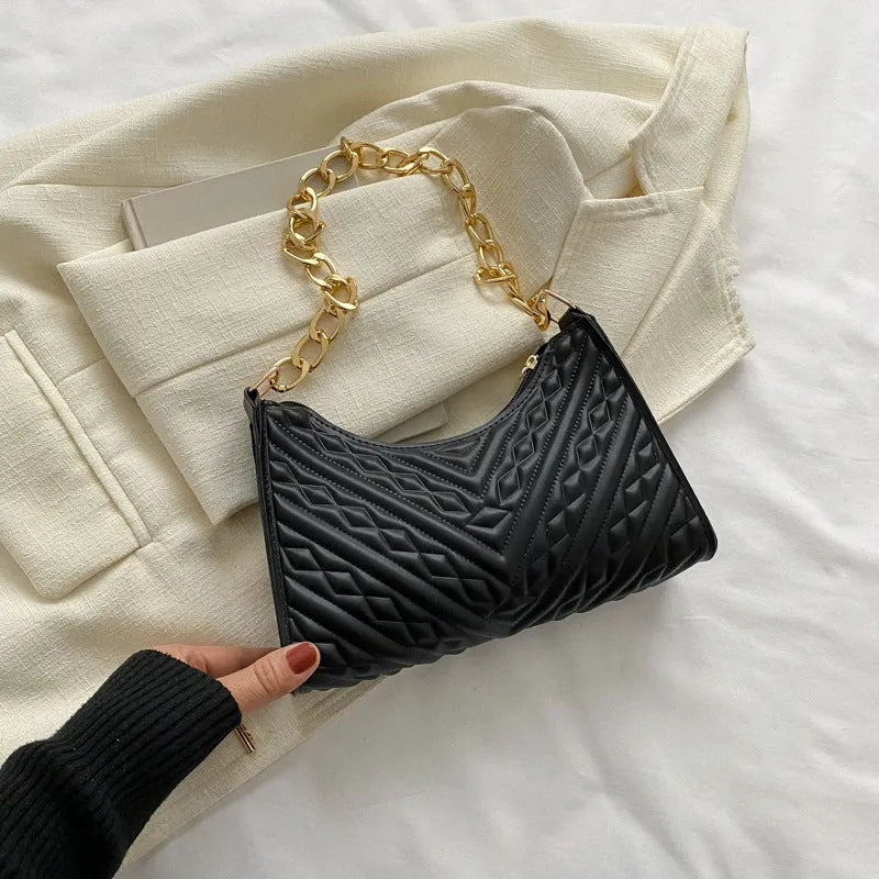 Brown pleated PU leather baguette bag with a gold-tone chain shoulder strap and a soft top handle.