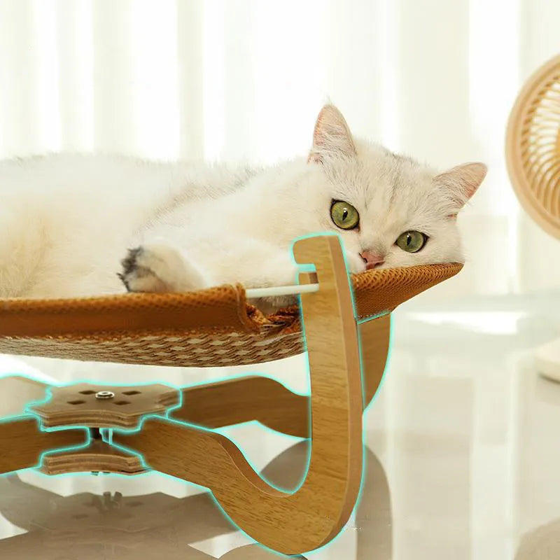 Brown woven rattan pet hammock bed for cats and small dogs on a white floor