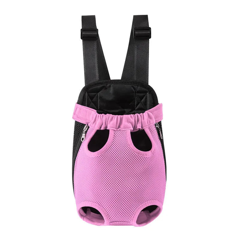 A person wearing a black nylon dog carrier backpack on their chest, containing a small dog looking out.