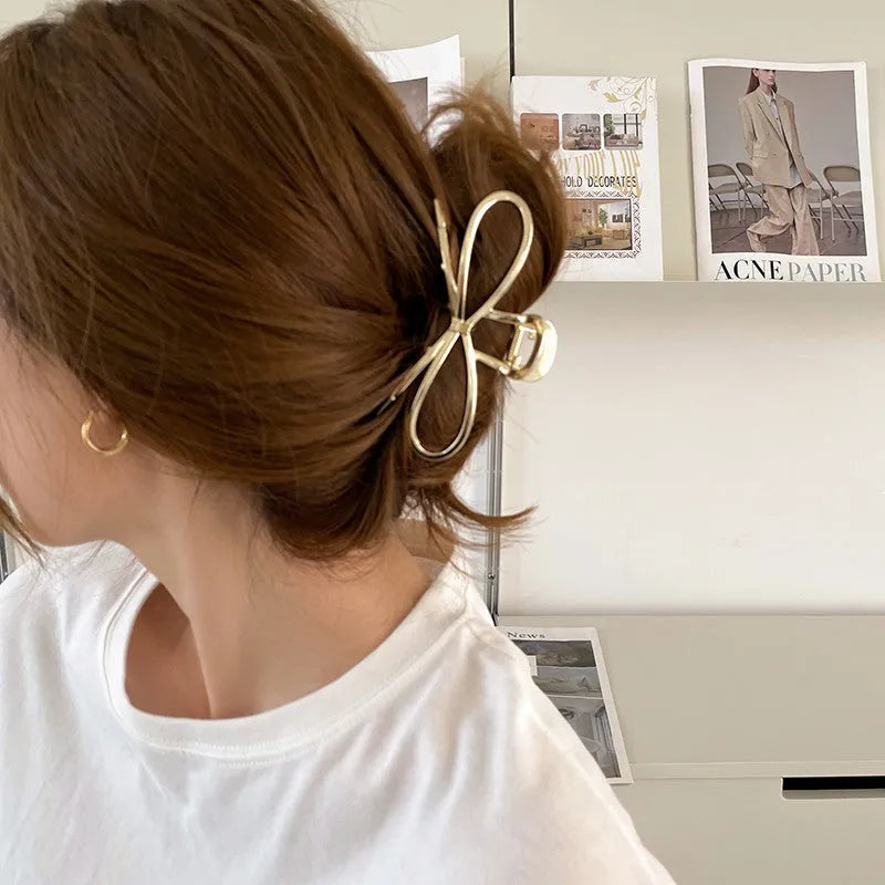 Bow barrette hair clip with back head grip in gold or silver alloy finish