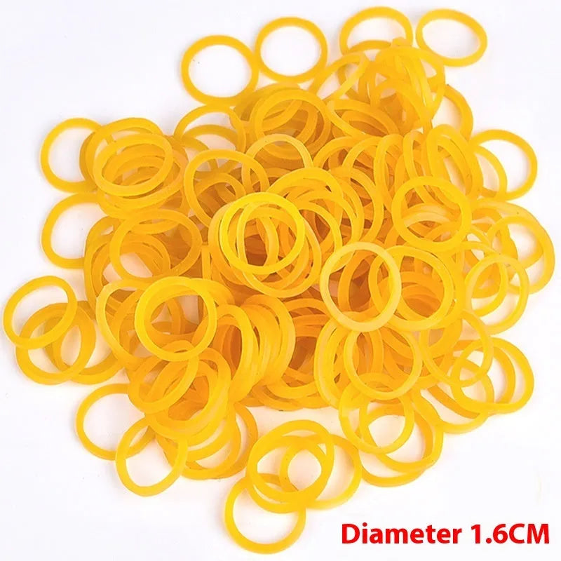 Yellow rubber bands in 500g bulk pack showing multiple diameter sizes from 25mm to 70mm