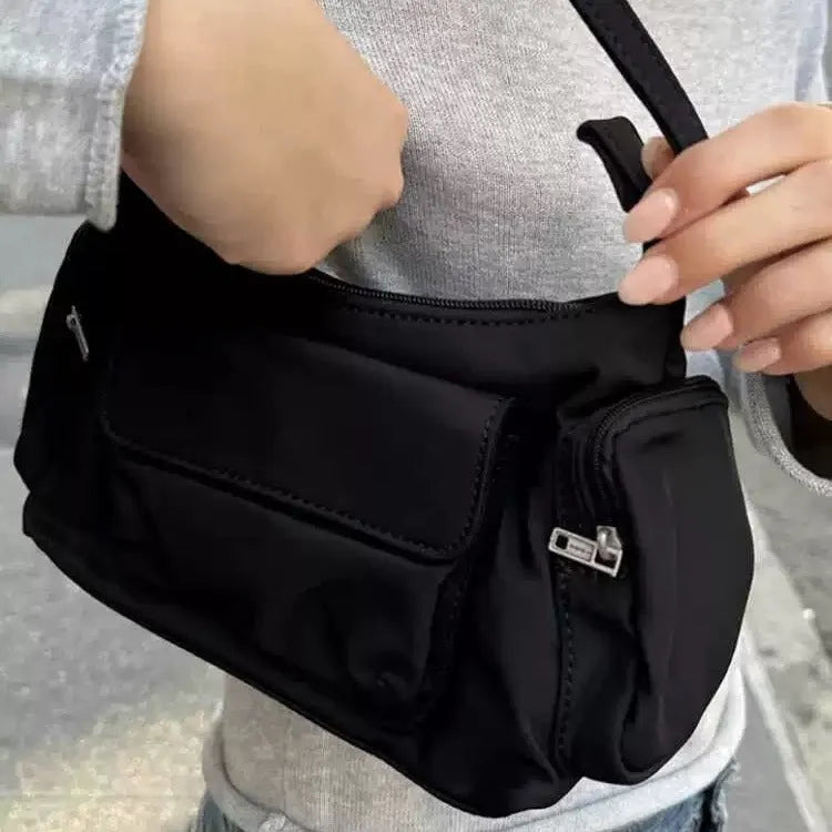 Black nylon unisex shoulder bag with double pockets and side line detail