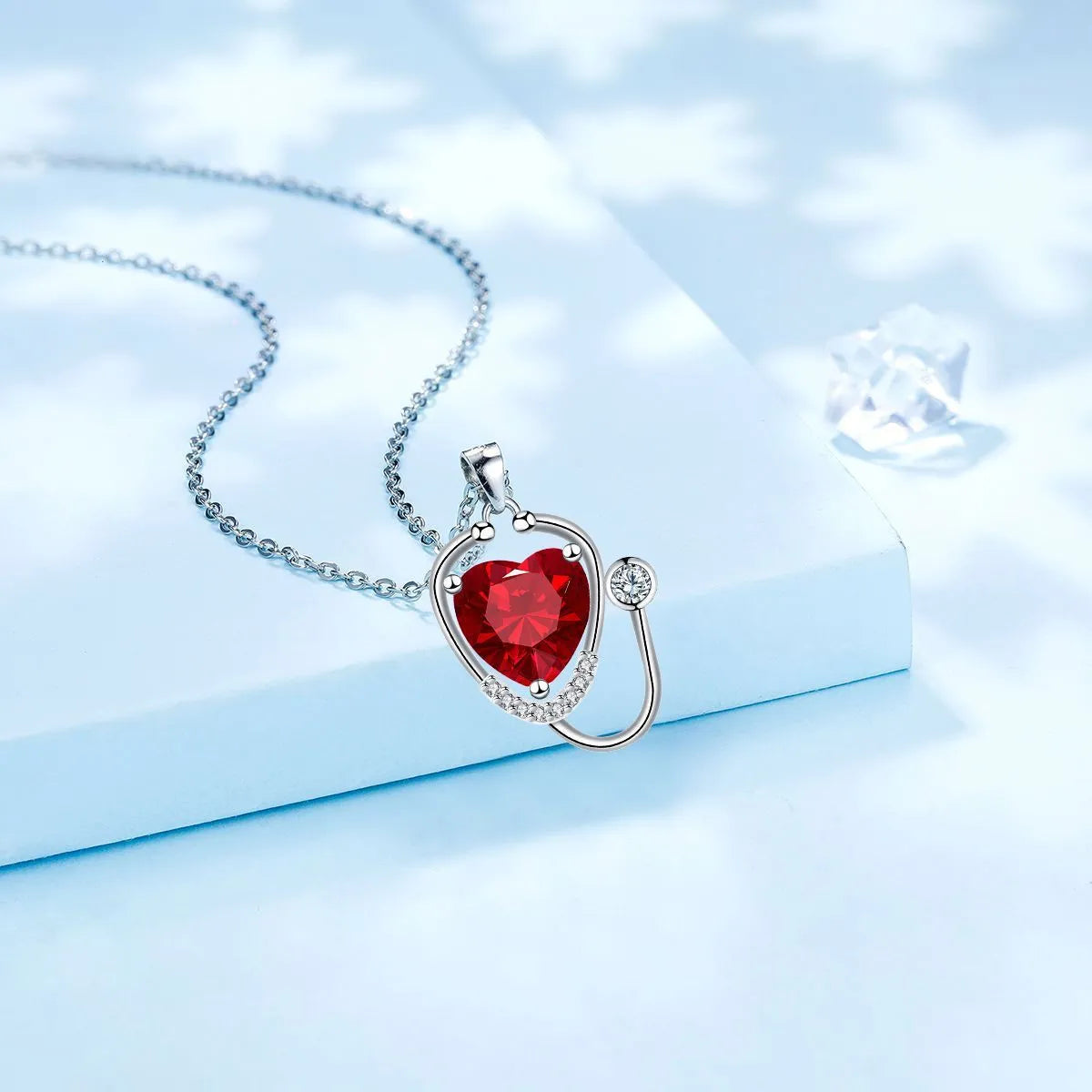 Red diamond wings cross stethoscope necklace for women, made from electroplated copper.