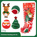 Christmas-themed vinyl dog toys including bite ropes, tennis balls, Santa heads, and deer figures in gift packaging