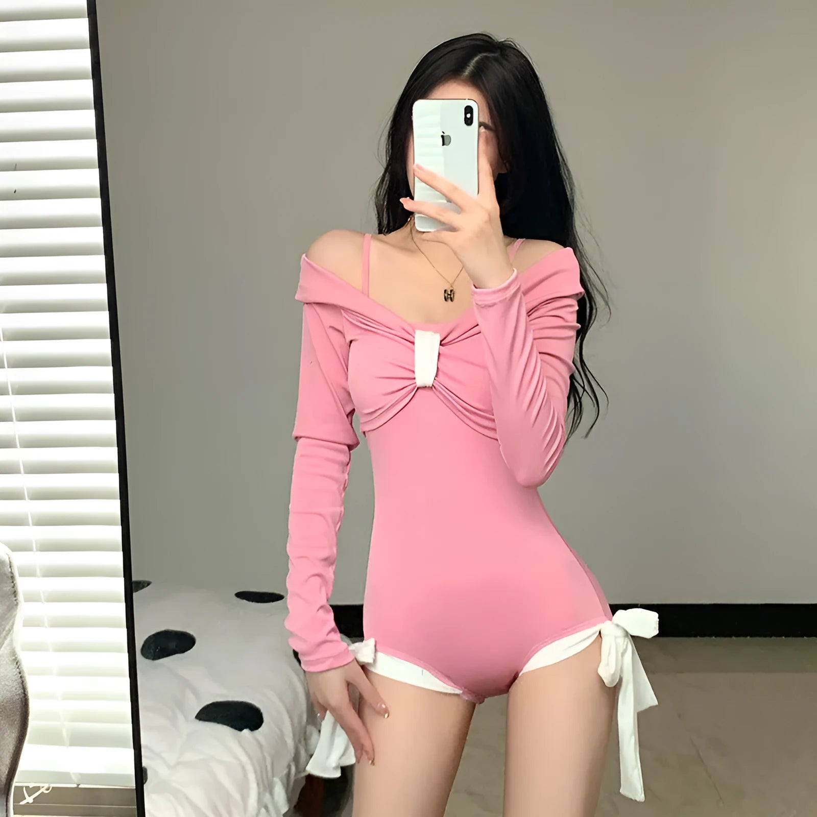 Women's long sleeve one-piece swimsuit in black or pink polyester fabric