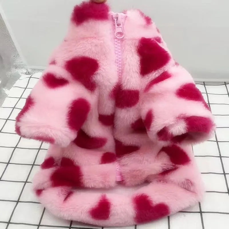 Pink polyester warm coat on small white dog showing British style design