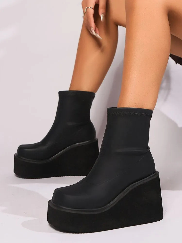 Plus size women's wedge heel boots with waterproof platform sole in black artificial PU leather