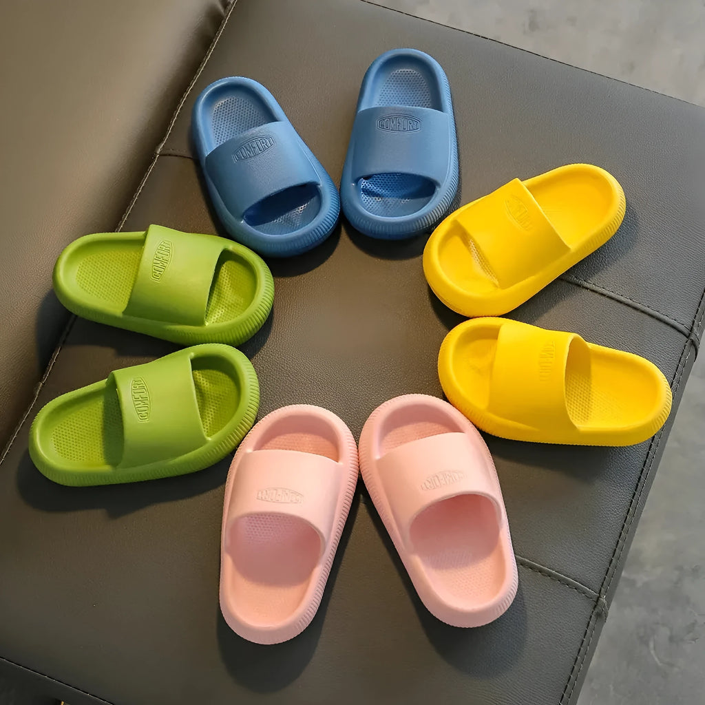 Brightly coloured children's EVA slippers with a textured non-slip sole, shown in multiple colour options.
