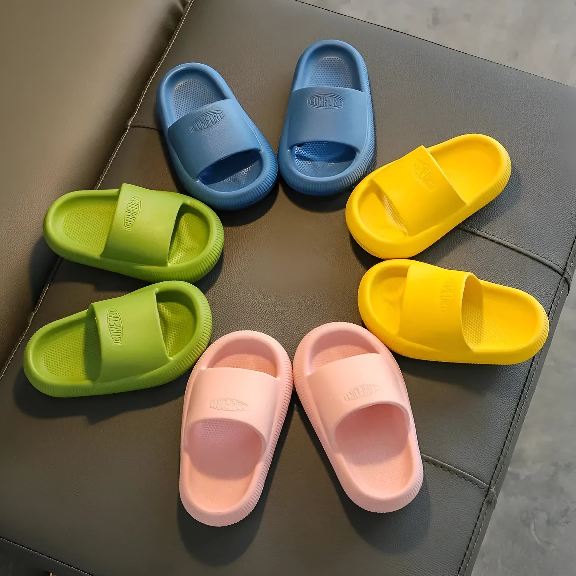 Brightly coloured children's EVA slippers with a textured non-slip sole, shown in multiple colour options.