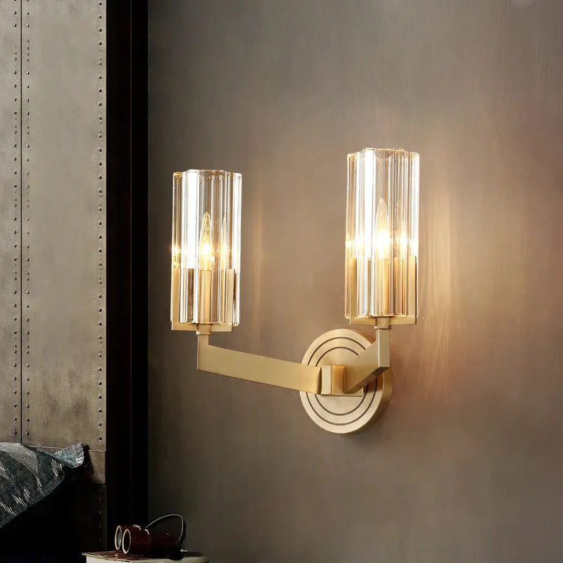 Modern minimalist copper wall lamp with single head design mounted on a wall.