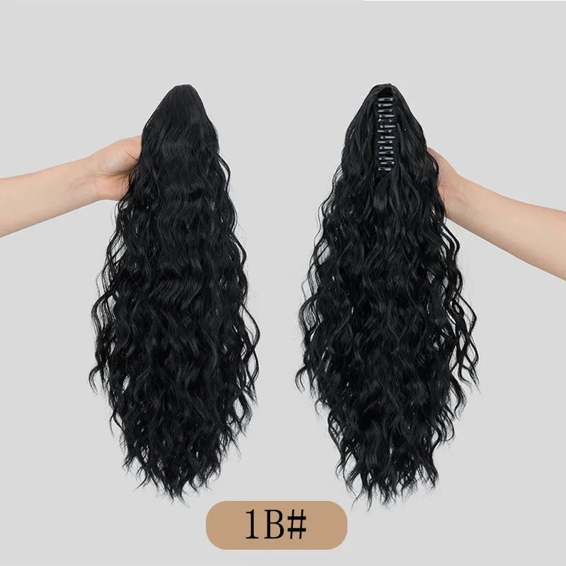 Synthetic corn curler wig with a textured water ripple grip ponytail, shown in a dark brown colour.