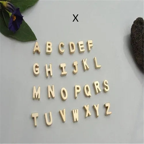 Gold and silver alloy peach heart shaped letter pendant necklace charm on a chain.