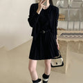 Women's black art retro knitted vest skirt and long sleeve cardigan two-piece set with belt.