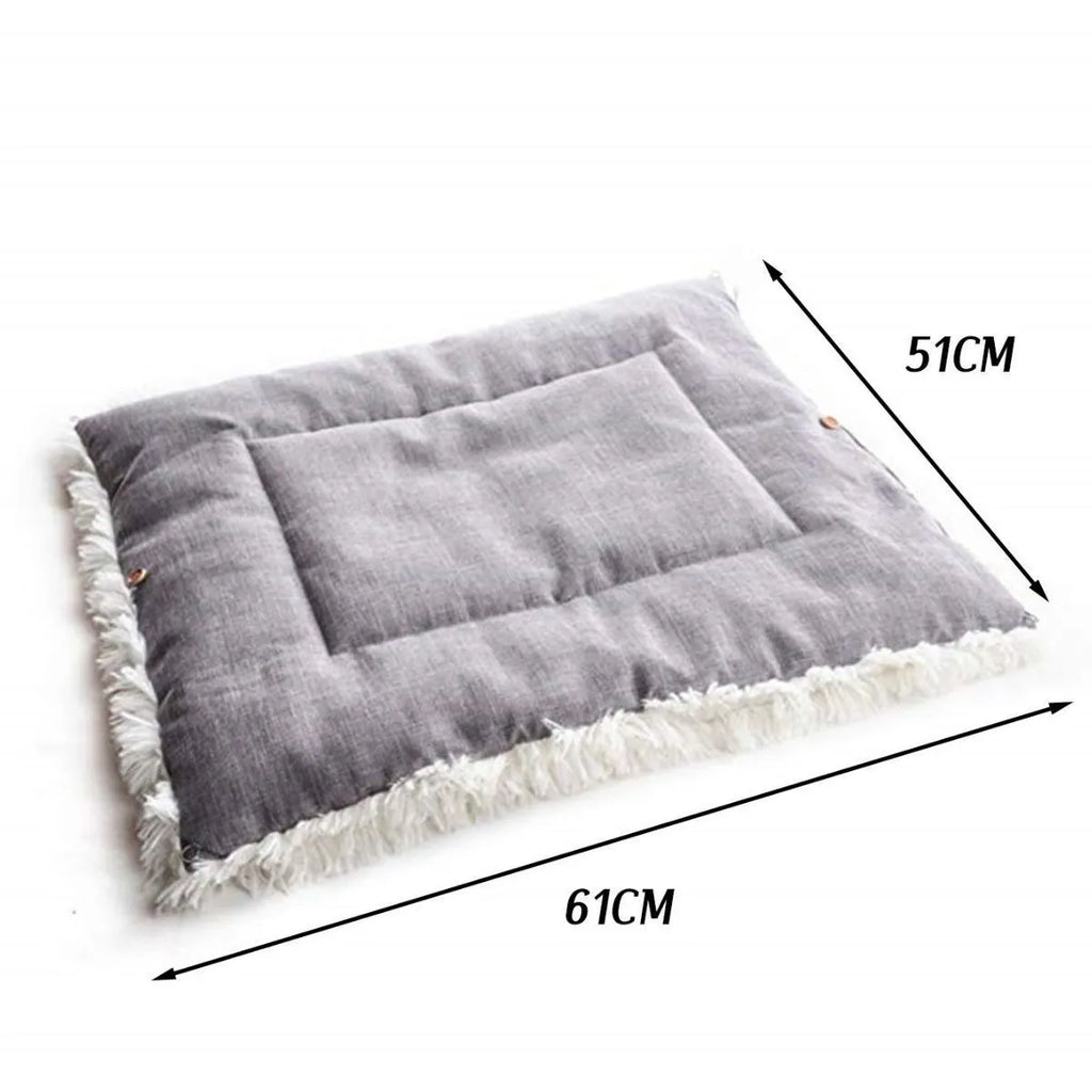 Grey pet plush sleeping pad measuring 61cm by 51cm with a black non-slip bottom.