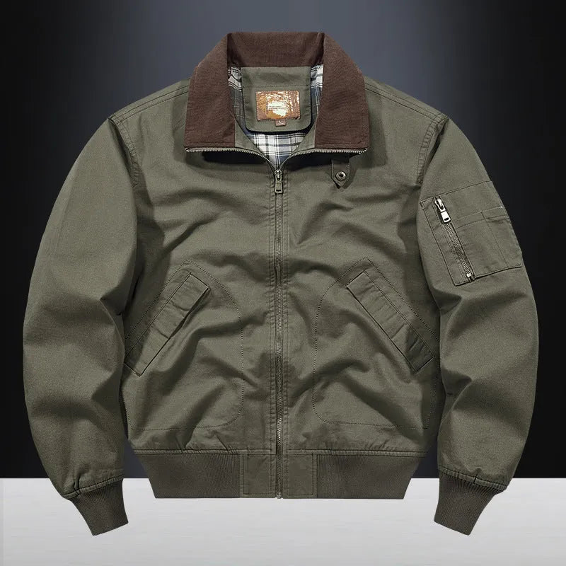 Men's washed cotton baseball-style flight jacket in beige, shown in a casual setting.