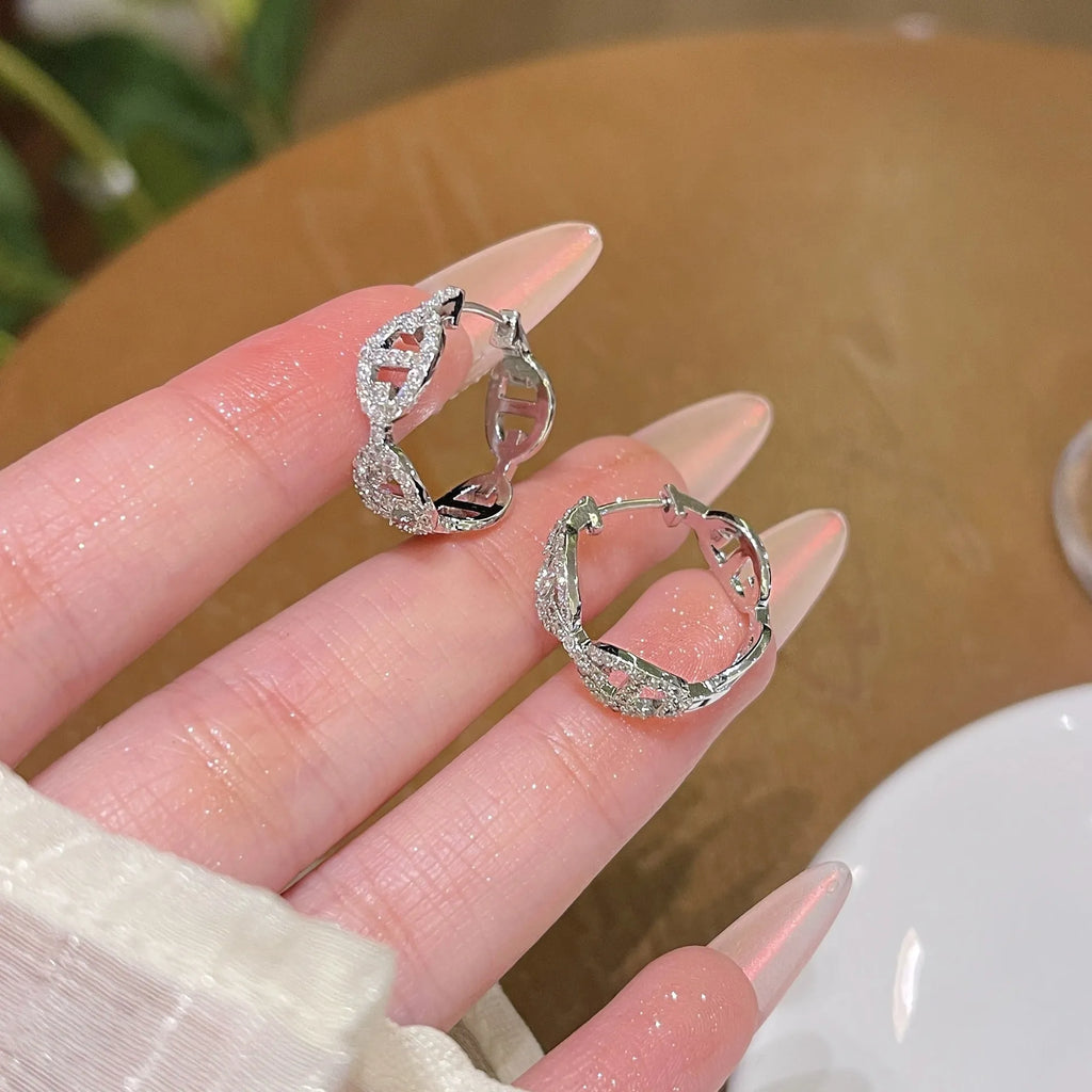 A pair of electroplated copper earrings with a diamond design in a choice of silver, gold, or rose gold thick plating.