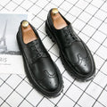 Men's black business brogue leather shoes with round toe design on white background
