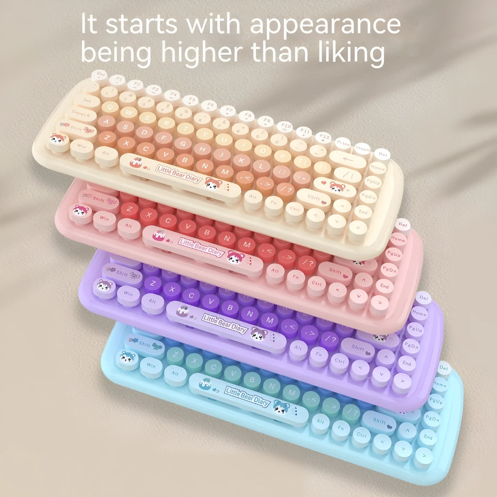 Candy pink wireless keyboard and mouse set with miniature cartoon design on a desk.