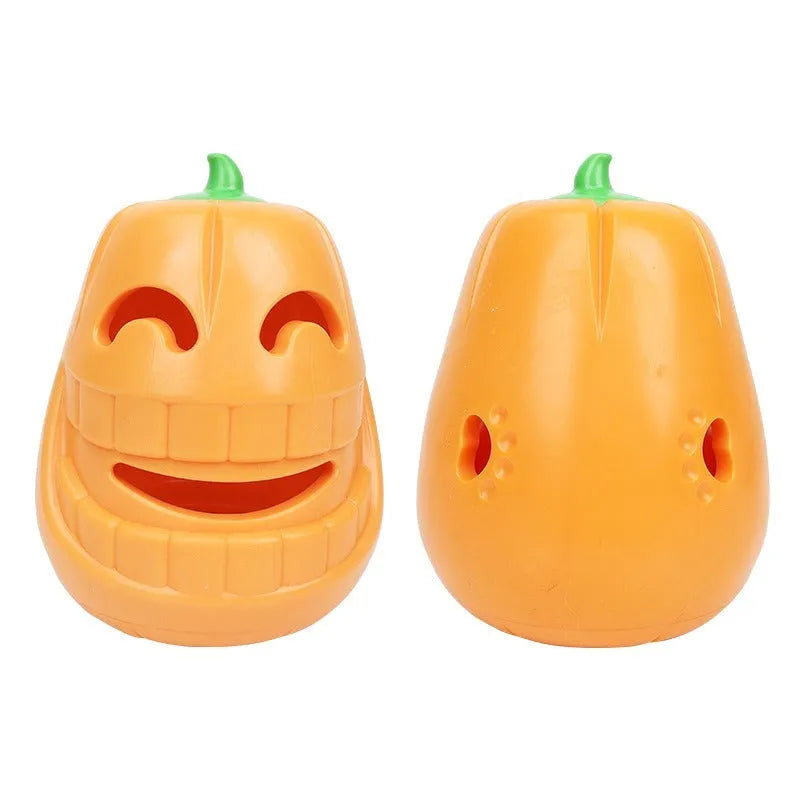 Orange Halloween pumpkin shaped interactive dog chew toy with treat-dispensing funnel.