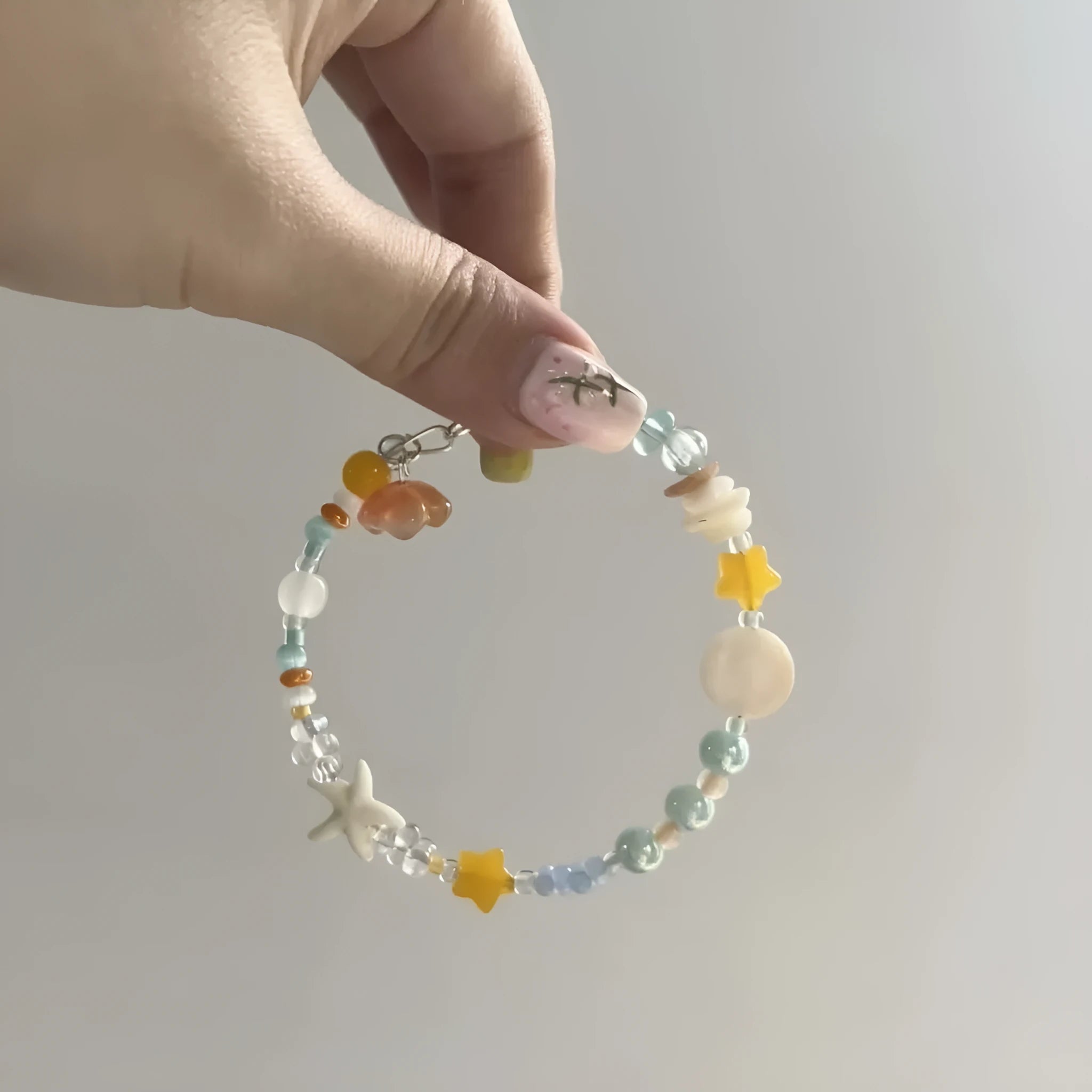 Orange seaside summer bracelet with round diamond elements and mixed alloy material construction