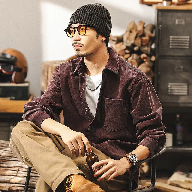 Men's red loose-fit corduroy style casual shirt jacket with long sleeves.