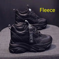 Women's black mesh platform casual slip-on shoes with a hollow-out toe holder design on a white background.