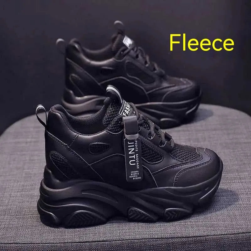 Women's black mesh platform casual slip-on shoes with a hollow-out toe holder design on a white background.