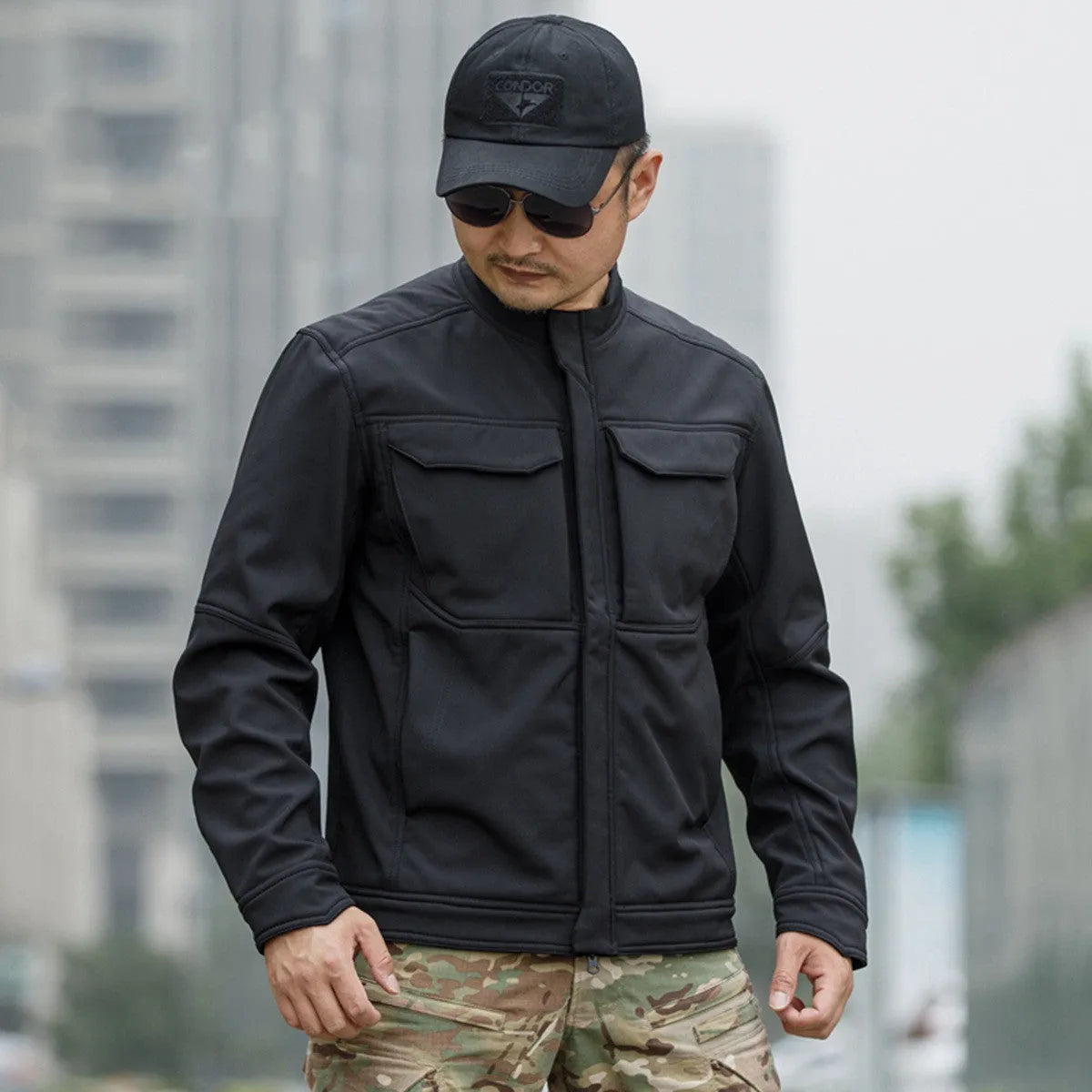 Bone Frog Peak Breaker black soft shell tactical jacket shown on model for mountaineering.