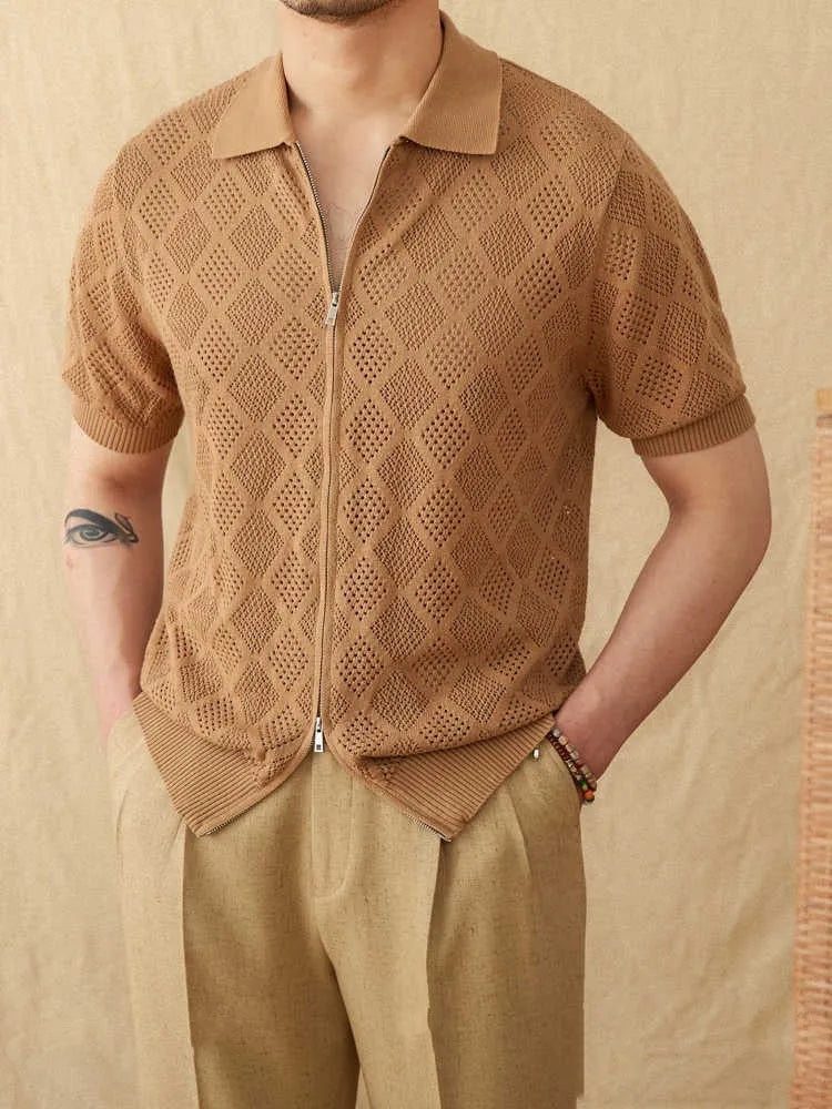 Light brown cotton short sleeve cardigan with zip front and lapel collar laid flat.