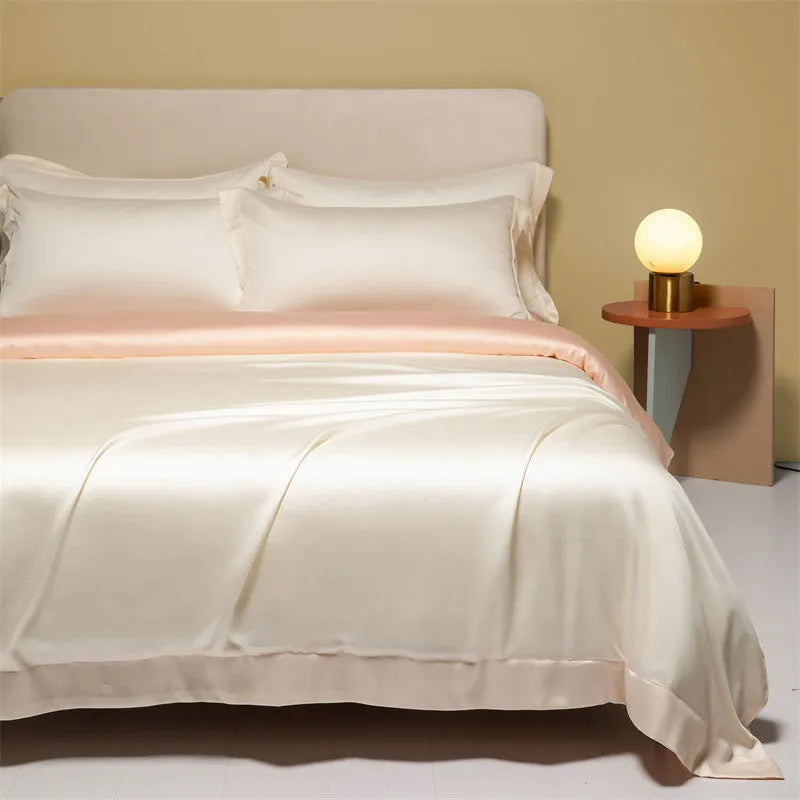 Four-piece Lenzing Tencel quilt sheet set in Antique White showing quilt cover and pillowcases with modern simple style
