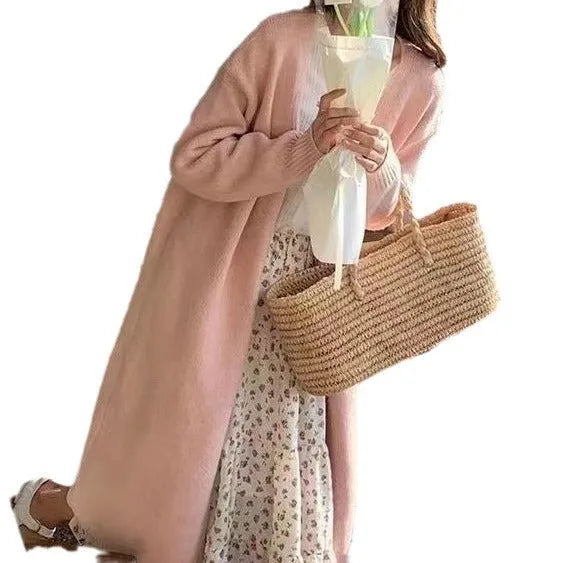 Women's knitted mid-length cardigan with V-neck in khaki colour showing loose fit design