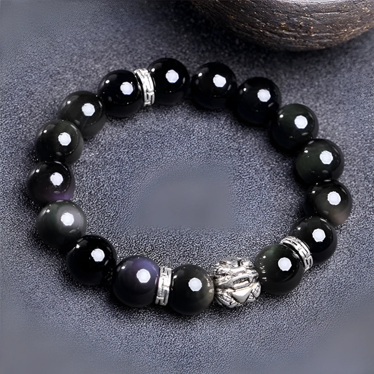 Unisex obsidian bracelet with lucky colour eye beads and silver cloud pattern detail, showing male 12mm and female 10mm sizes.