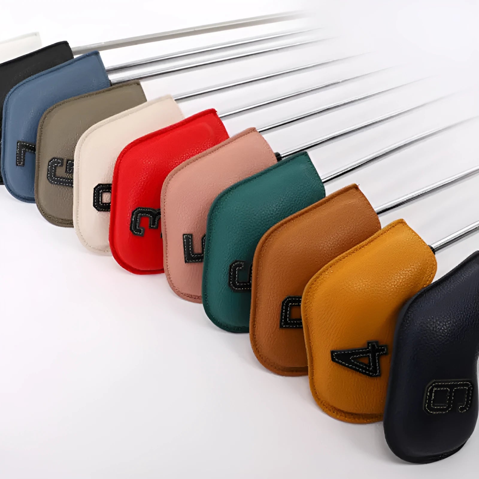 Set of 10 printed PU golf club head covers in assorted digital patterns.