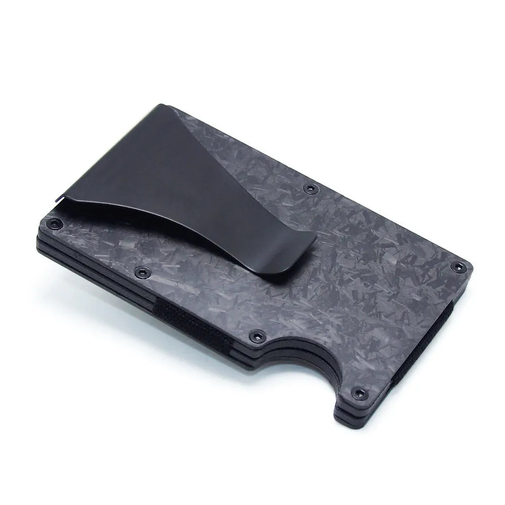 Carbon fibre geometric wallet card holder showing 8mm thickness holding multiple bank cards