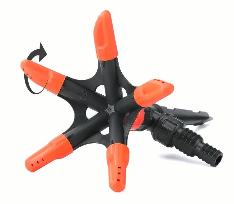 Orange plastic garden insert sprinkler with rotating water spray, 14 x 26.5cm, single nozzle